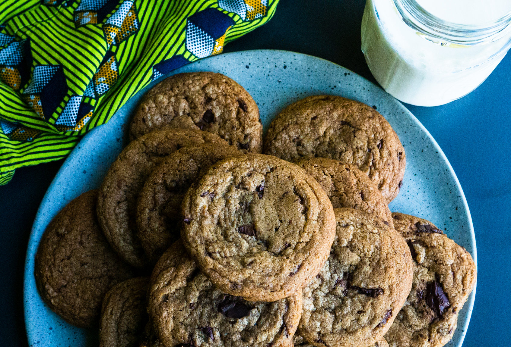 plate of cookies with a glass of milk and napkin