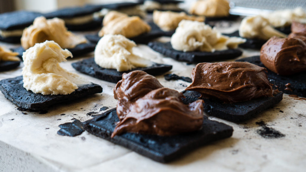 chocolate wafer cookies with chocolate frosting and cream cheese frosting