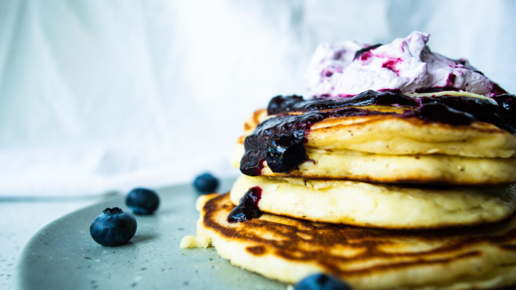 buttermilk pancake with blueberry sauce and whip