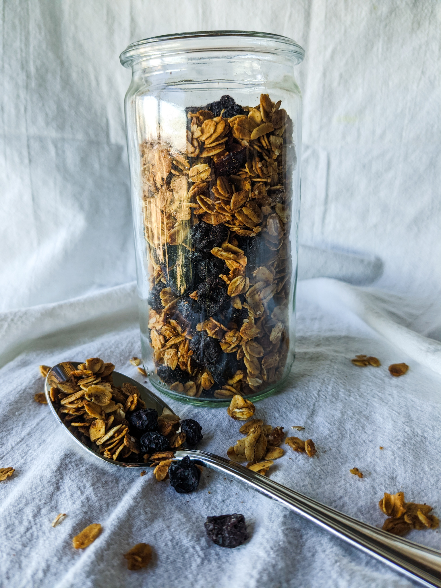 granola with dried fruit and spoon