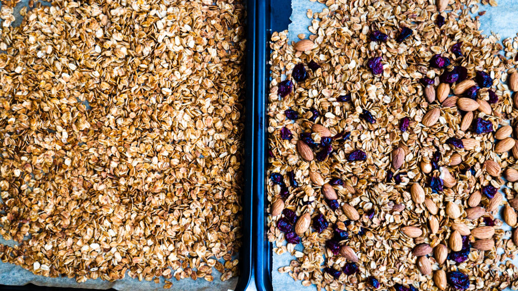 cooked granola in baking pans