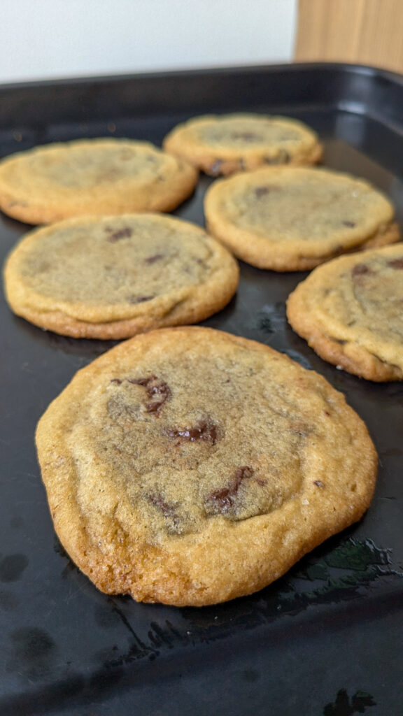 chocolate chip cookies on a black tray