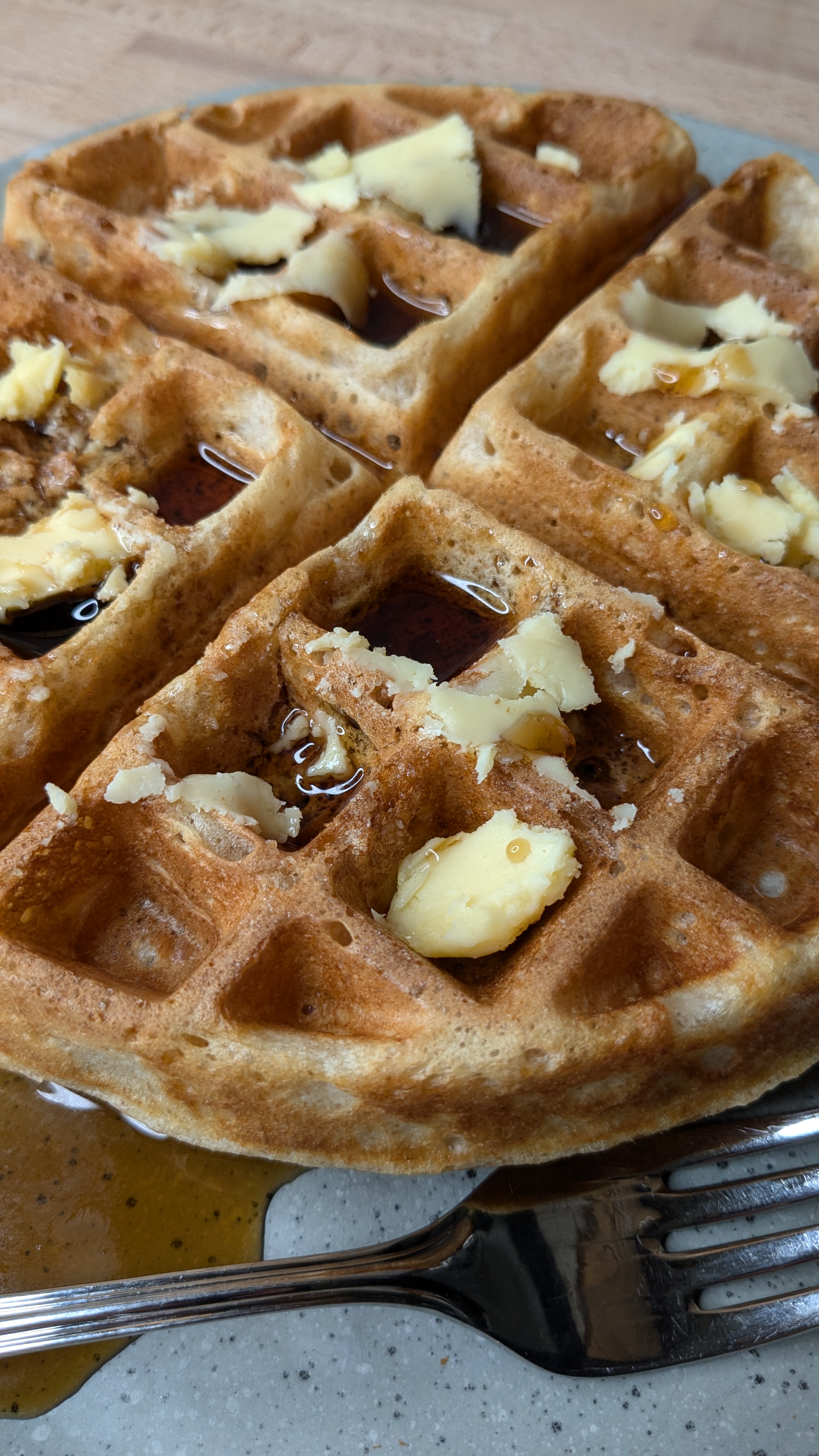 sourdough waffle with butter and maple syrup