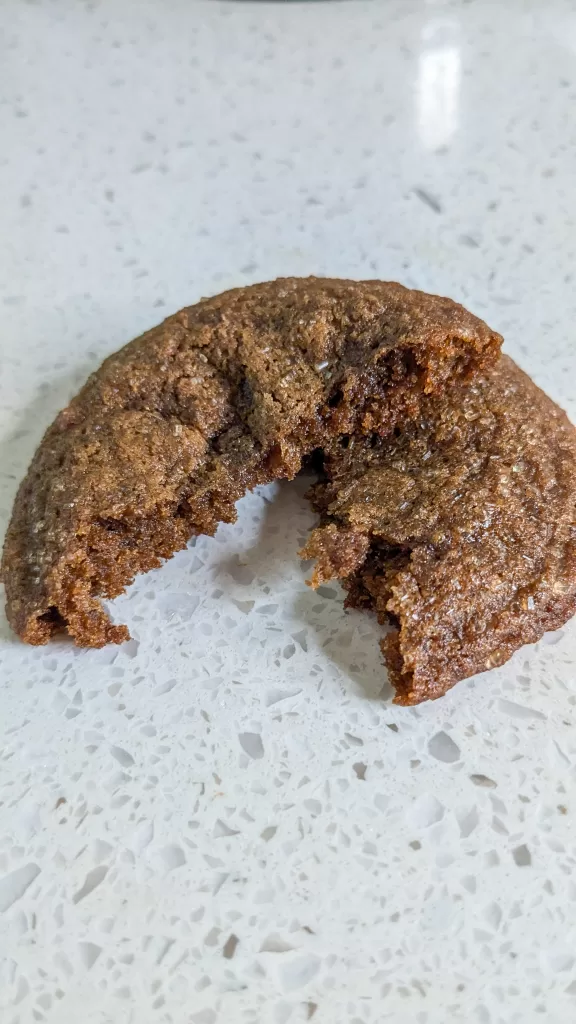 a molasses spiced cookie broken in half